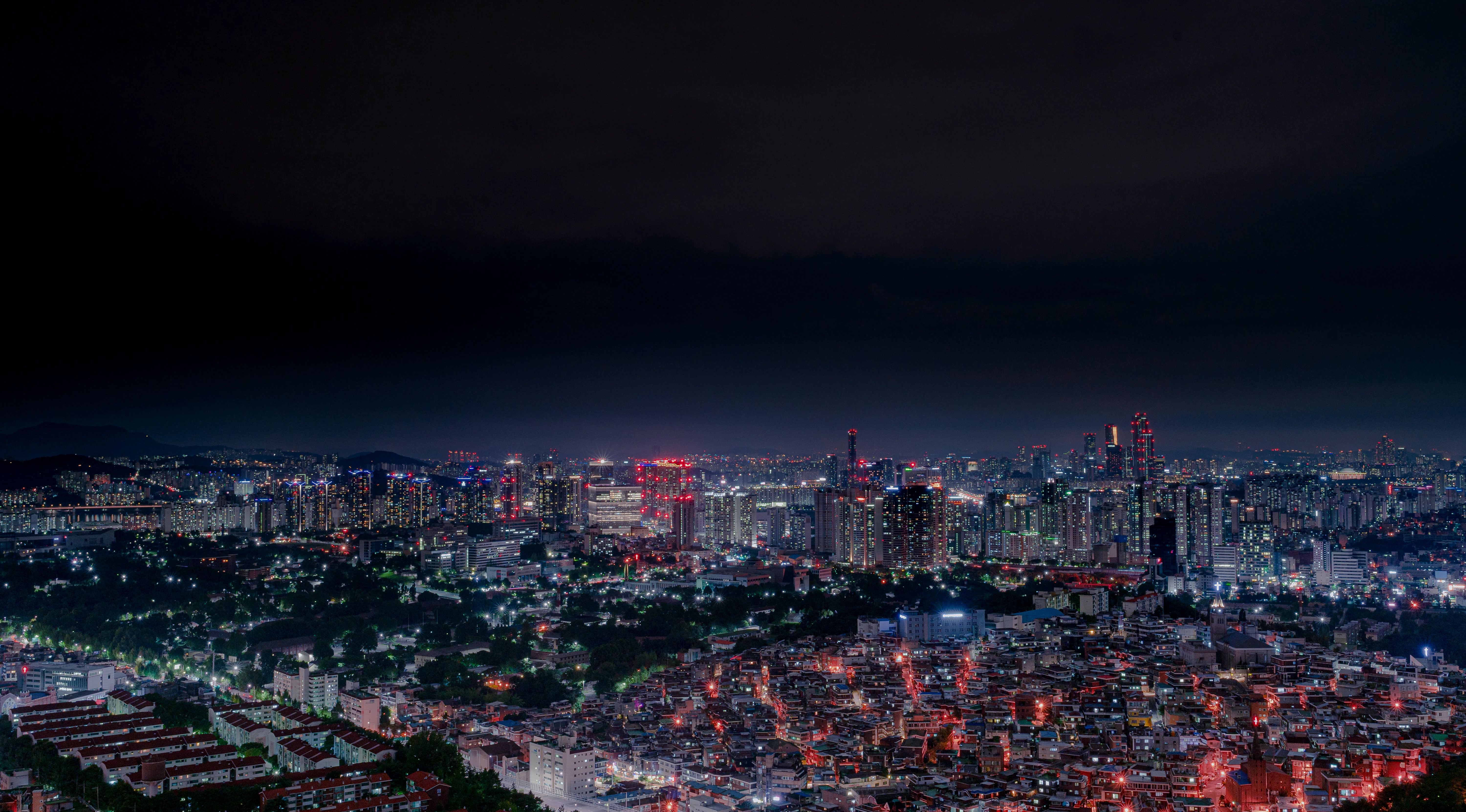 Vibrant Seoul Skyline Illuminated Under the Midnight Sky
